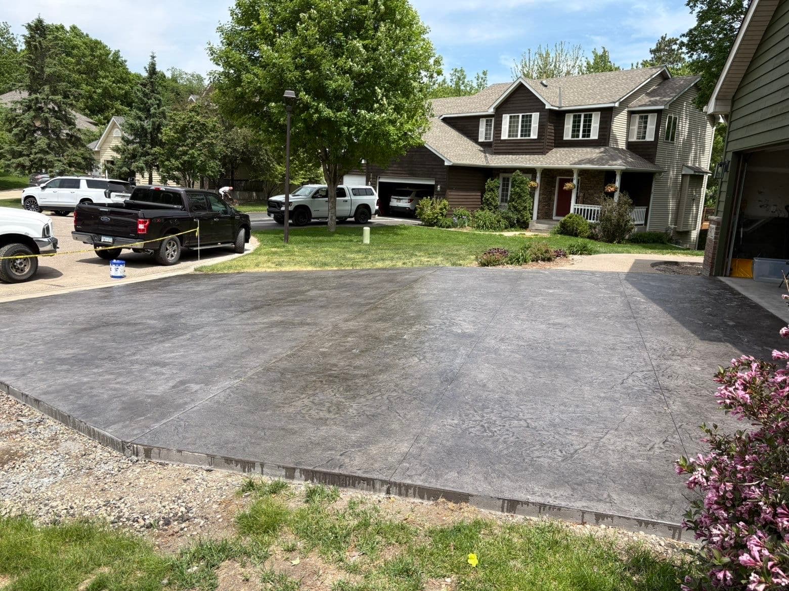 Gallery photos for Slate Gray Roman Slate Stamped Concrete Driveway with Black Accent: Image #1