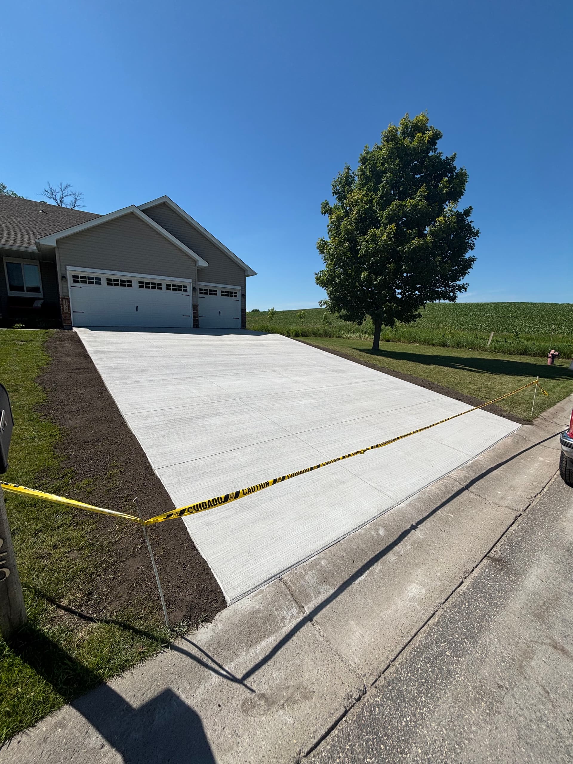 Gallery photos for Cracked Asphalt Out, Fresh Concrete Driveway In: Image #1